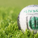 Golf ball with $100 bill design.