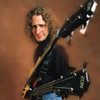 Michael Manring with a double-neck Zon Hyperbass guitar. [Thumbnail]