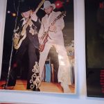 Chad's music room it 2021, with a poster (zoomed in) of 1970s-era Dusty Hill and Billy Gibbons making sweet, sweet music.